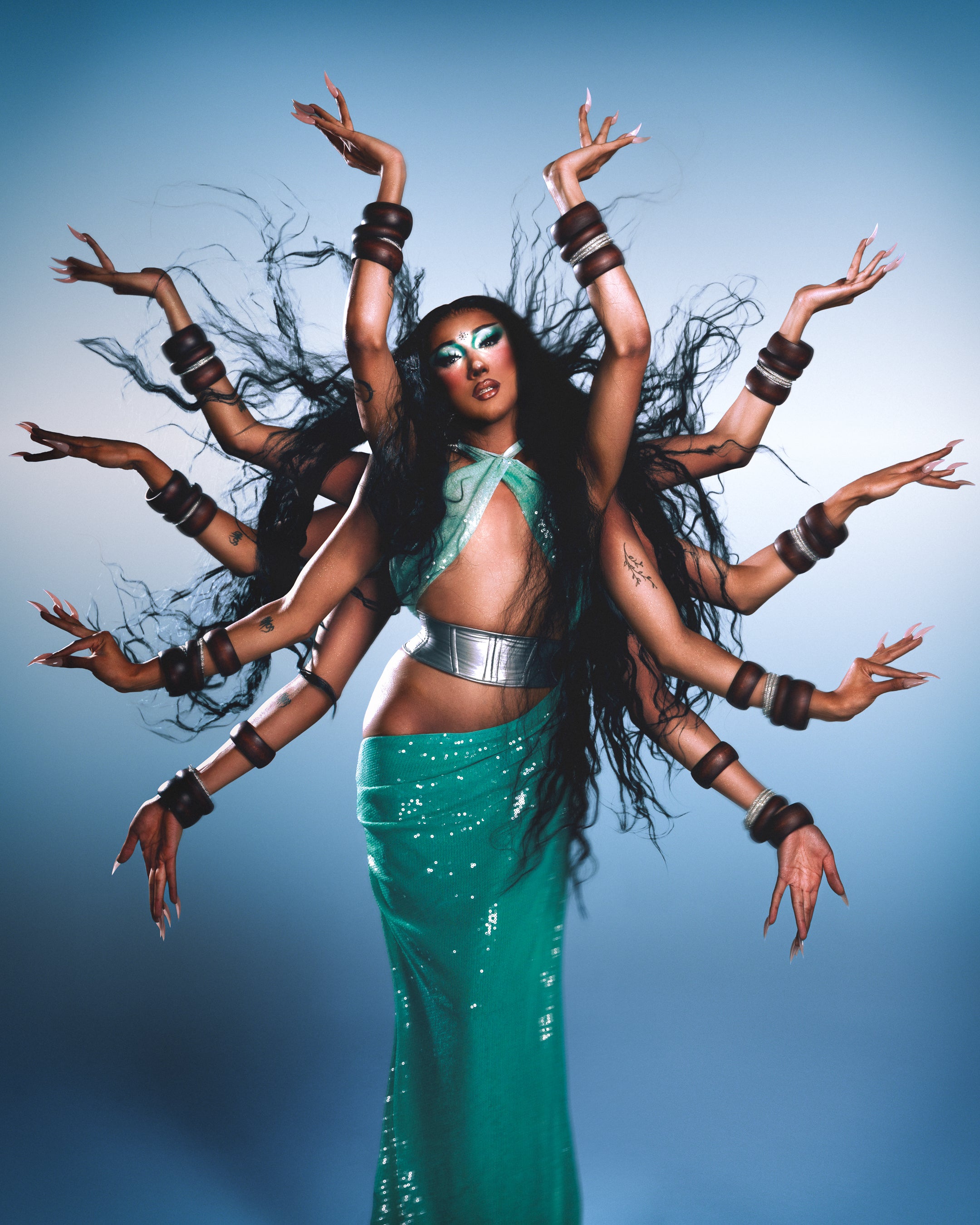 Drag Queen Superstar Rae Oblivion with multiple arms